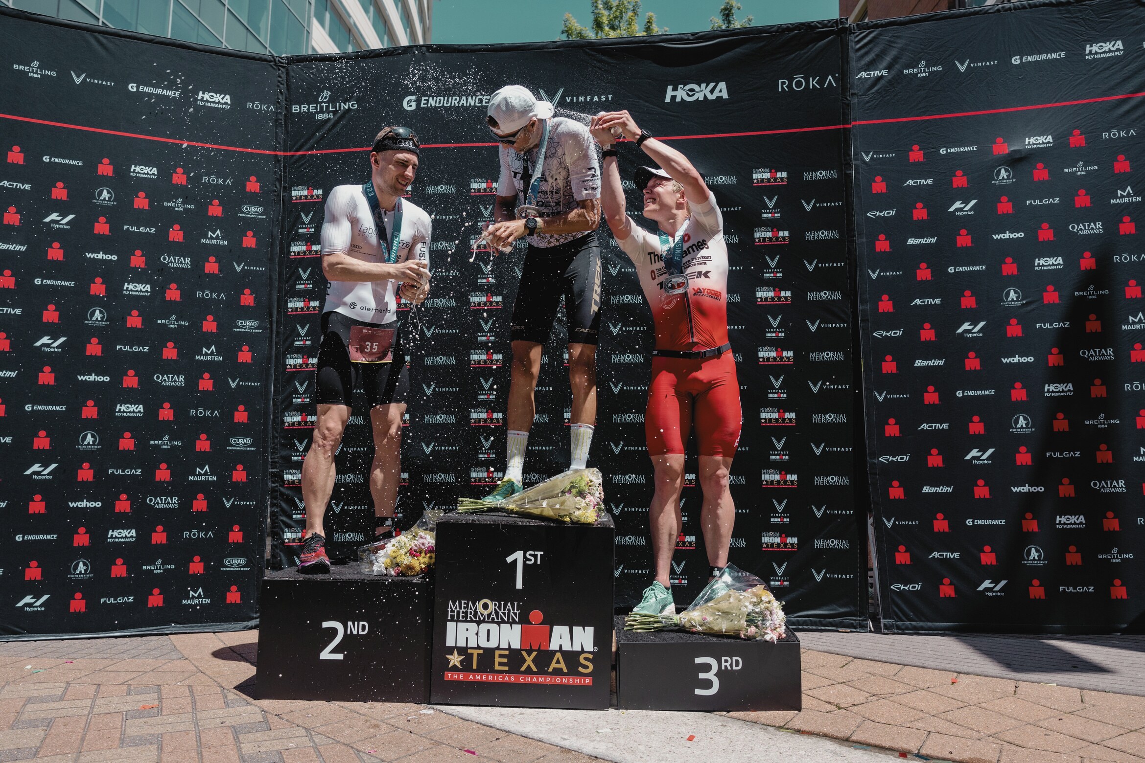 Robert Wilkowiecki on the Ironman Americas Championship podium